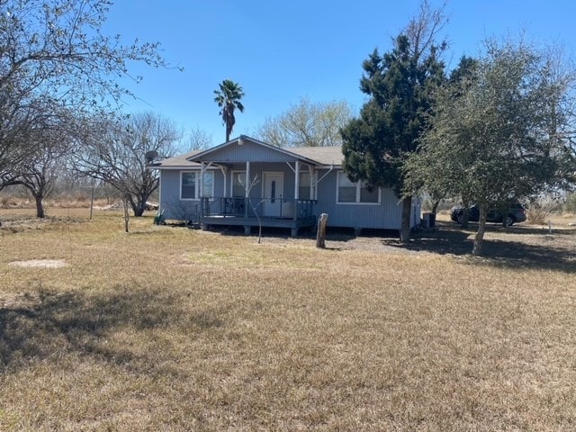 view of front of house featuring a front yard and covered porch