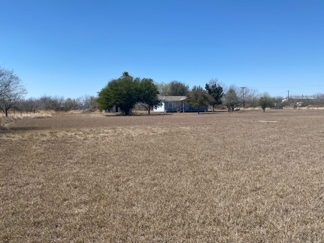 view of yard with a rural view