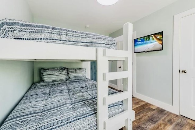 bedroom with wood finished floors