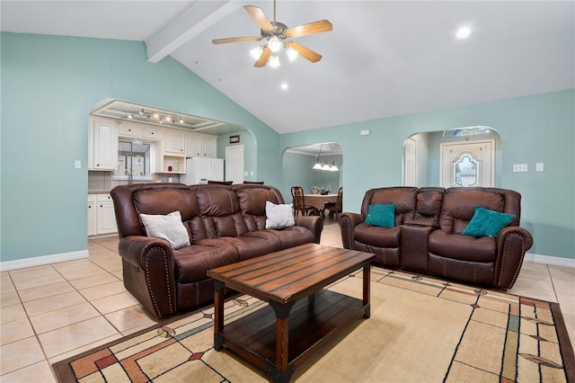 tiled living room with ceiling fan and vaulted ceiling with beams