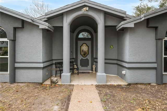 doorway to property featuring a patio area