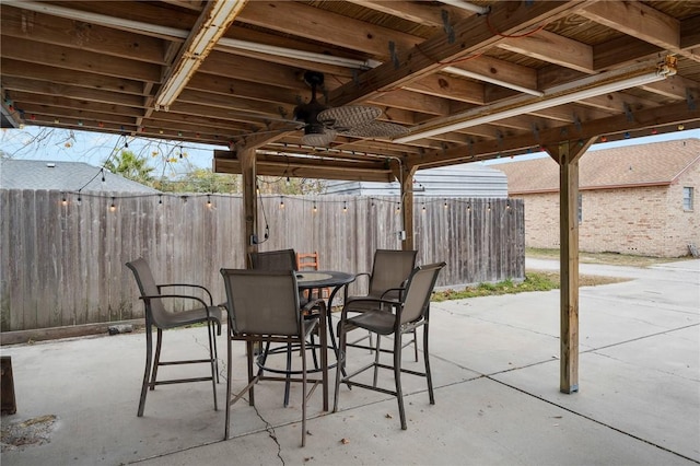 view of patio featuring ceiling fan