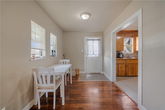 dining space featuring light wood-type flooring