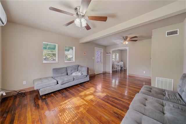 living room featuring beam ceiling, ceiling fan, and dark hardwood / wood-style floors