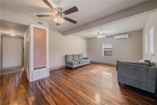 living room featuring an AC wall unit, a wealth of natural light, and dark wood-type flooring