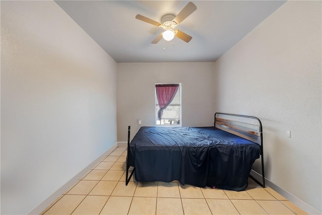 tiled bedroom with ceiling fan