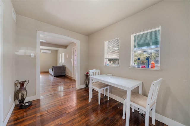 dining space featuring dark hardwood / wood-style floors