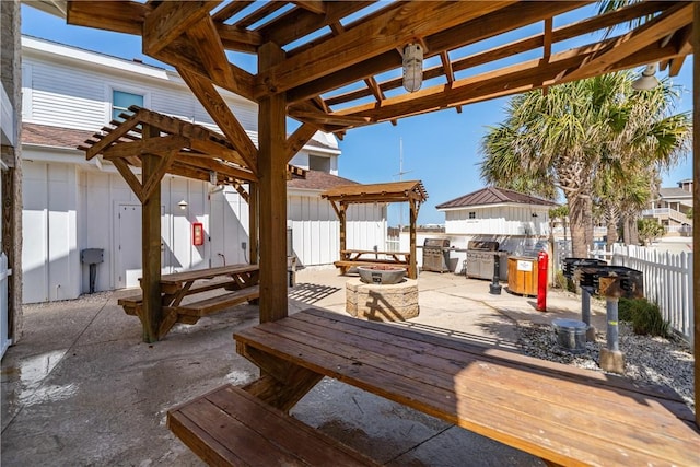 view of patio / terrace with outdoor dining area, fence, area for grilling, and a pergola