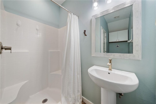 full bath featuring visible vents, a shower stall, and a sink