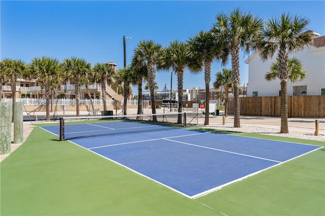 view of sport court with fence