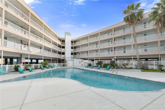 view of swimming pool with a patio area