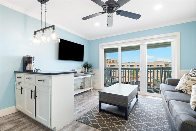 3938 Surfside Blvd Unit 1319, Corpus Christi, TX 78402 - living area featuring ornamental molding, wood finished floors, a ceiling fan, wainscoting, and recessed lighting