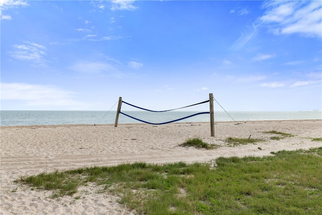 view of home's community with a beach view and a water view