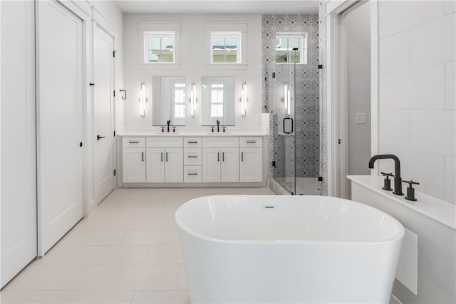 bathroom with vanity, shower with separate bathtub, tile patterned flooring, and plenty of natural light