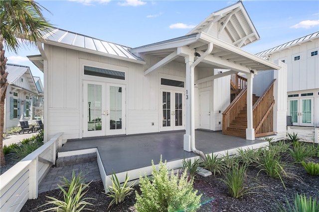 back of property featuring french doors and a patio area