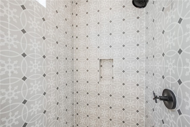 details with a tile shower