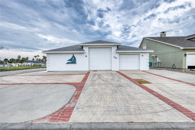 ranch-style home featuring a garage