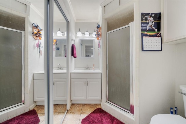 10637 Westwood Dr, Corpus Christi, TX 78410 - bathroom featuring a stall shower, vanity, tile patterned floors, and crown molding