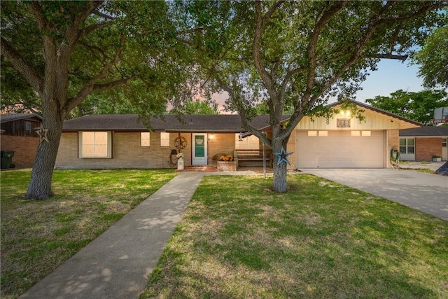 10637 Westwood Dr, Corpus Christi, TX 78410 - ranch-style house with driveway, a front lawn, brick siding, and a garage