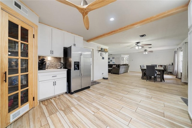 10637 Westwood Dr, Corpus Christi, TX 78410 - kitchen featuring stainless steel fridge, tasteful backsplash, a ceiling fan, white cabinetry, and recessed lighting