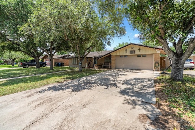 10637 Westwood Dr, Corpus Christi, TX 78410 - ranch-style house with a garage, driveway, a front lawn, and brick siding