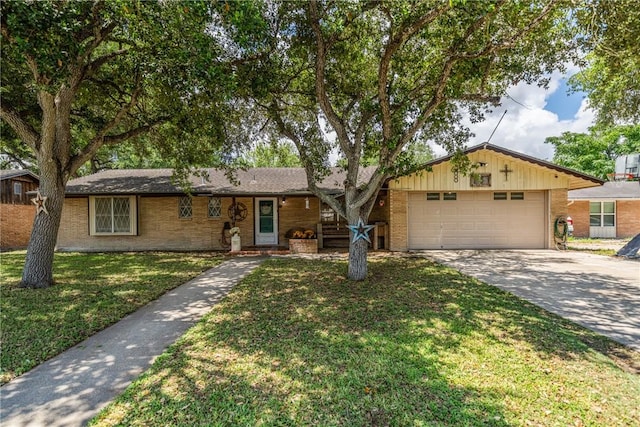 10637 Westwood Dr, Corpus Christi, TX 78410 - ranch-style home featuring brick siding, driveway, a garage, and a front yard
