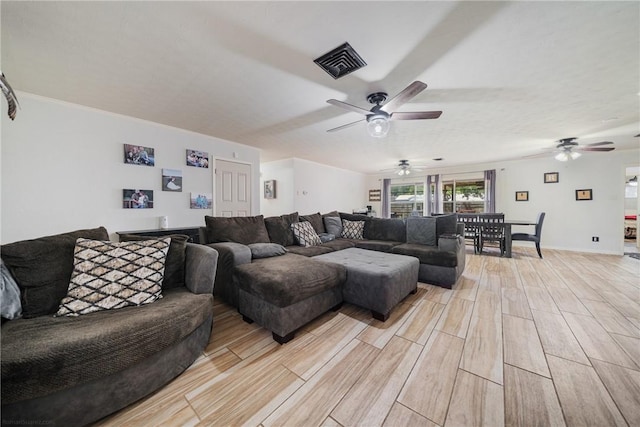 10637 Westwood Dr, Corpus Christi, TX 78410 - living room with a ceiling fan and light wood-style floors