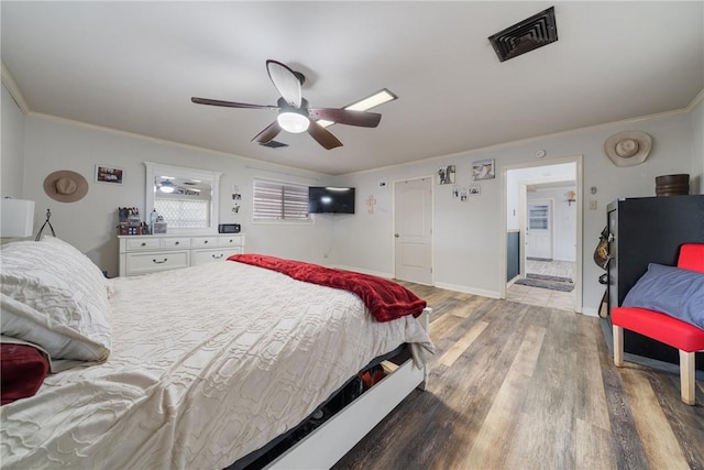 10637 Westwood Dr, Corpus Christi, TX 78410 - bedroom with crown molding, wood finished floors, and ceiling fan