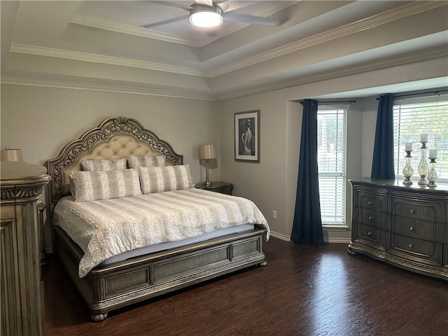 6333 Oso Pkwy, Corpus Christi, TX 78414 - bedroom featuring a tray ceiling, dark wood finished floors, baseboards, ornamental molding, and ceiling fan