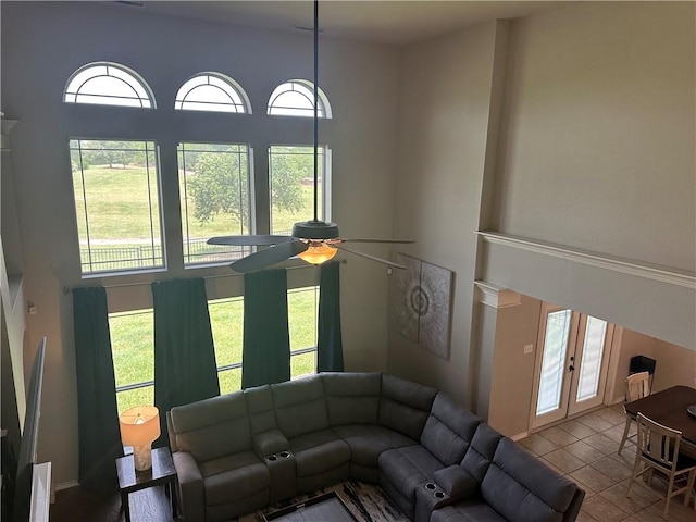 6333 Oso Pkwy, Corpus Christi, TX 78414 - tiled living room with a ceiling fan and french doors