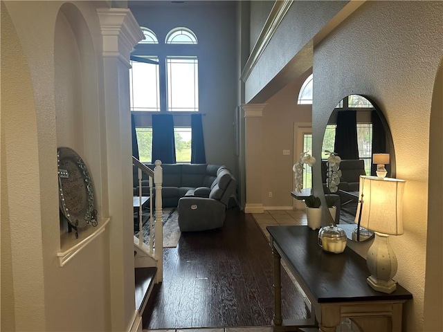 6333 Oso Pkwy, Corpus Christi, TX 78414 - entryway featuring wood-type flooring, plenty of natural light, a towering ceiling, and a textured wall