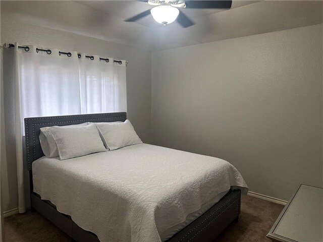 6333 Oso Pkwy, Corpus Christi, TX 78414 - bedroom featuring dark carpet, baseboards, and a ceiling fan
