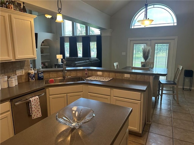 6333 Oso Pkwy, Corpus Christi, TX 78414 - kitchen featuring dishwasher, a sink, dark countertops, a peninsula, and open floor plan