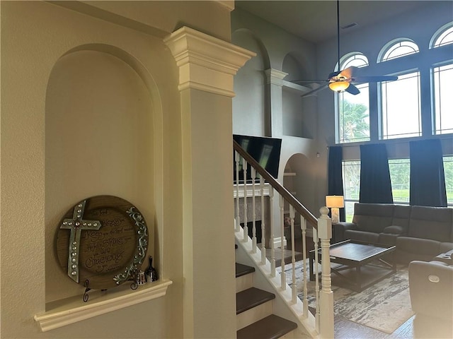 6333 Oso Pkwy, Corpus Christi, TX 78414 - stairway with ceiling fan, a towering ceiling, and wood finished floors