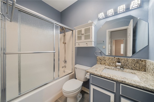 full bathroom featuring tile patterned flooring, vanity, toilet, and enclosed tub / shower combo