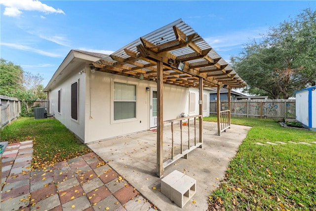 view of patio / terrace featuring a pergola and central AC