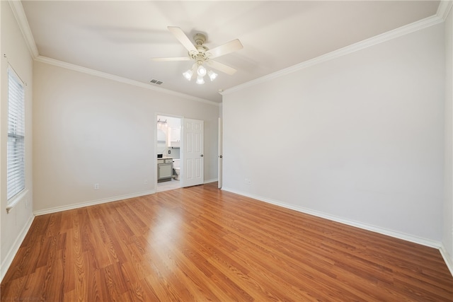 unfurnished room featuring ceiling fan, ornamental molding, and light hardwood / wood-style flooring