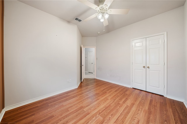 unfurnished bedroom featuring a closet, ceiling fan, and light hardwood / wood-style flooring