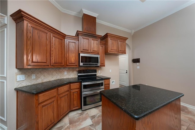 kitchen with appliances with stainless steel finishes, brown cabinets, ornamental molding, and backsplash