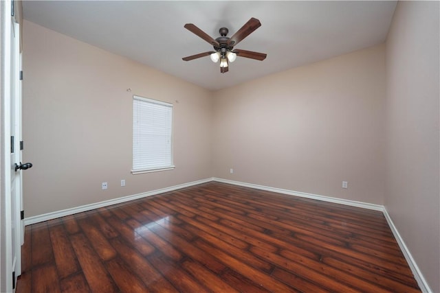 spare room featuring ceiling fan, baseboards, and wood finished floors