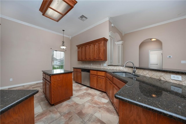 kitchen with tasteful backsplash, visible vents, brown cabinetry, dishwasher, and a sink