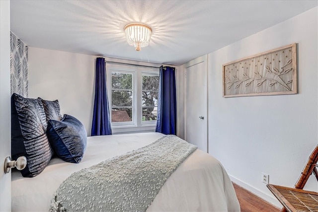 bedroom featuring wood-type flooring