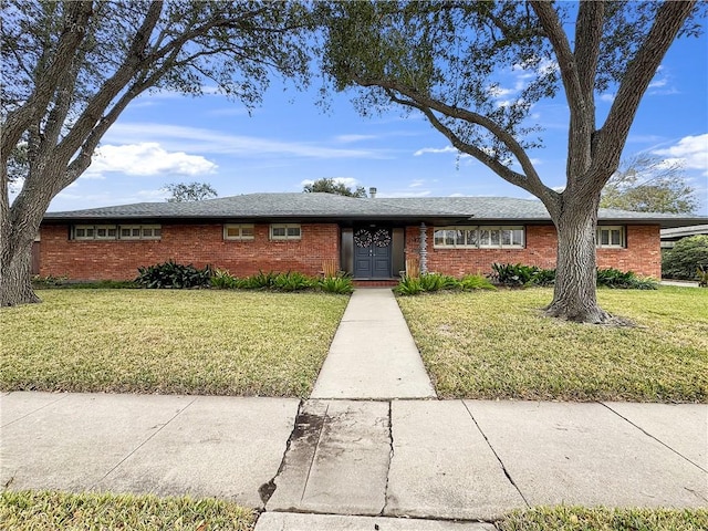 ranch-style house with a front yard