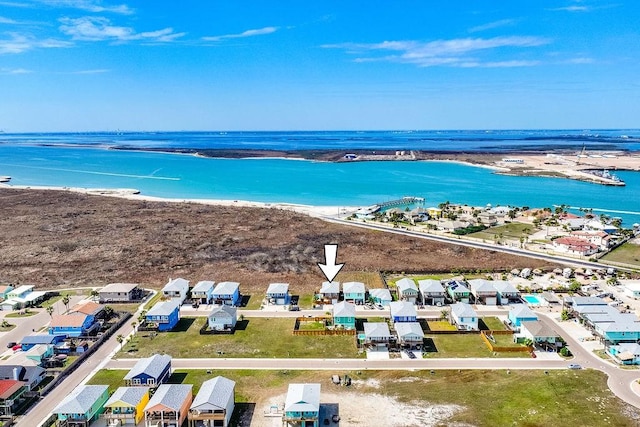 birds eye view of property featuring a water view and a residential view