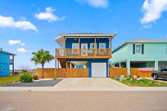 view of front of property with driveway, a gate, and fence