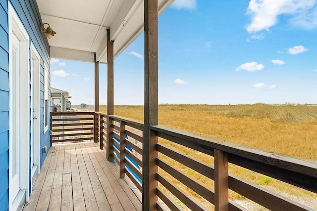 wooden terrace with a rural view