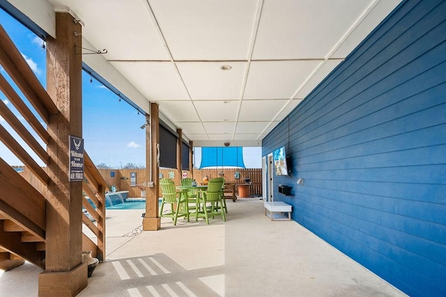 view of patio / terrace with a fenced backyard and an outdoor pool