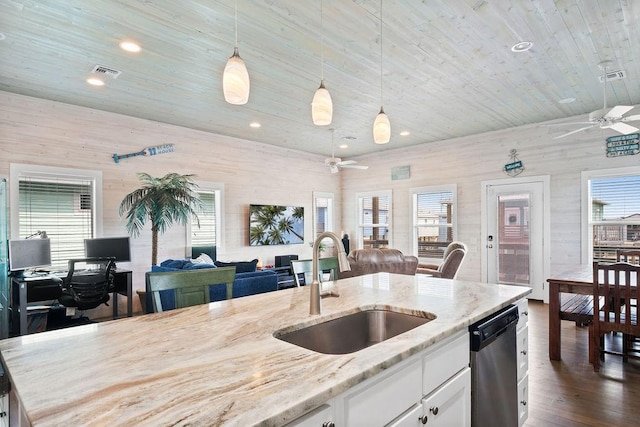 kitchen featuring visible vents, dishwasher, a ceiling fan, open floor plan, and a sink