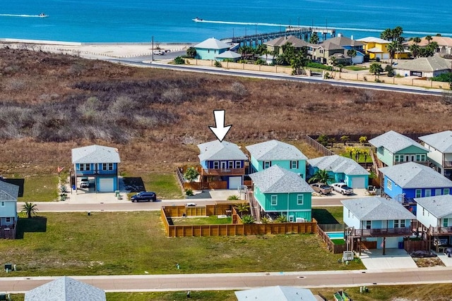 birds eye view of property featuring a water view and a residential view