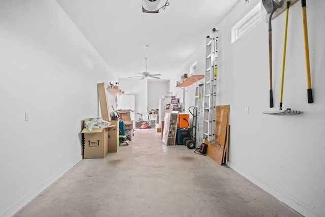 interior space featuring a ceiling fan and baseboards